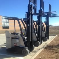 Three Crown RC5500 forklifts lined up ready for service
